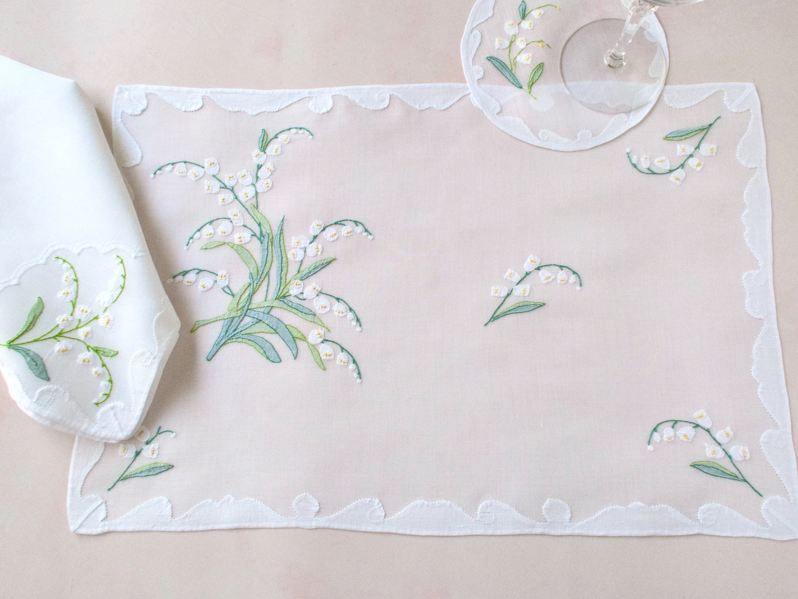Lily of the Valley vintage Madeira placemat and napkin shown together, hand embroidered shadow work on organdy.