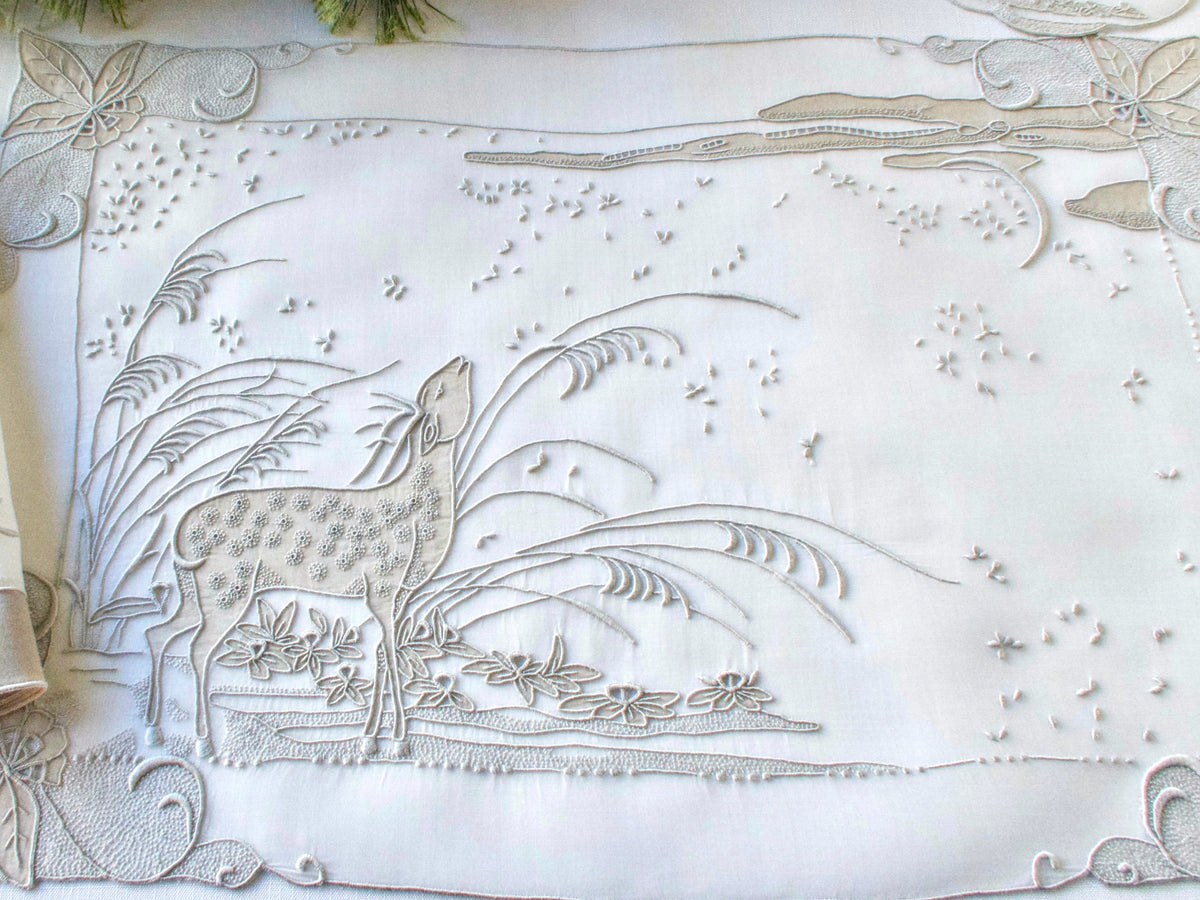 Vintage Marghab “Deer” placemat showing full scenic embroidery design with deer amid grasses and flowers.