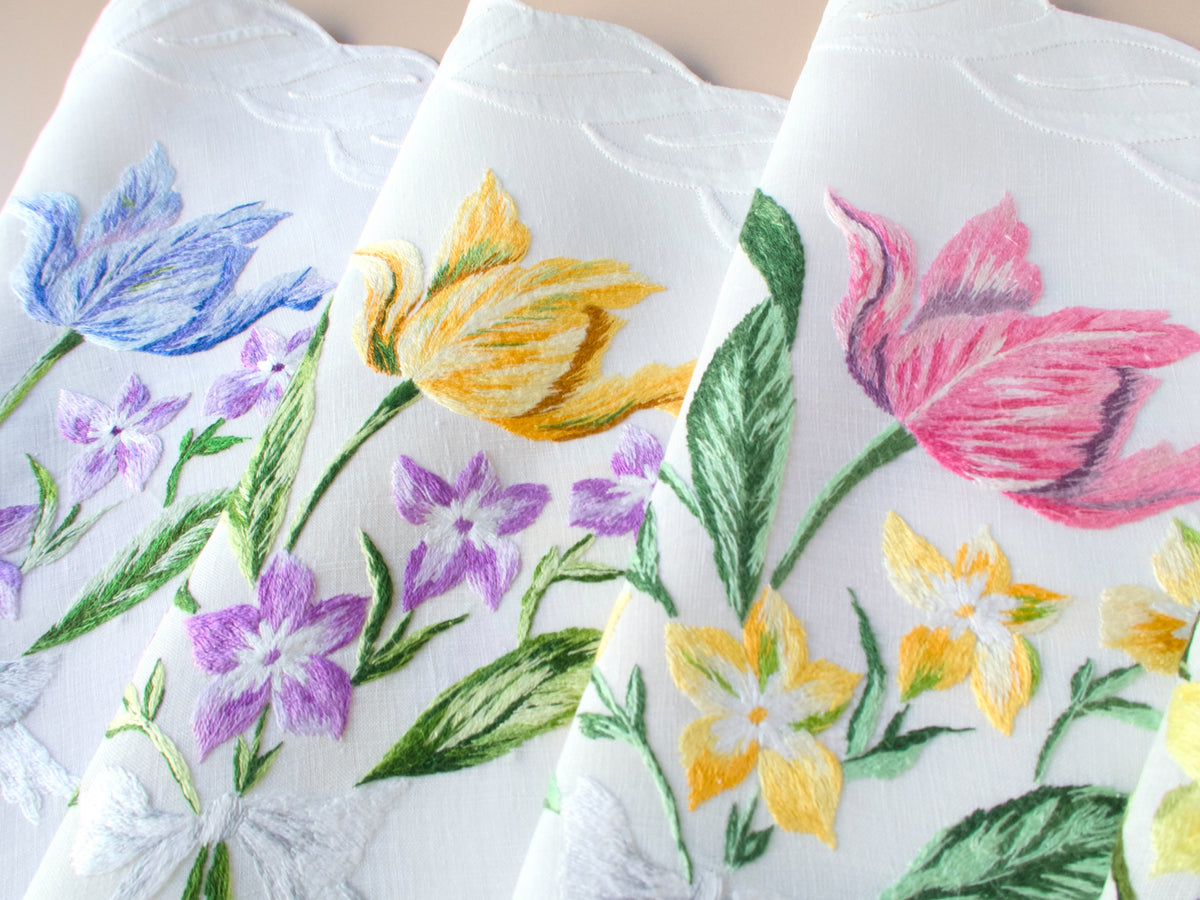 Vintage D. Porthault hand embroidered French linen with large yellow tulips, pink tulips, and clusters of purple and blue bellflowers.