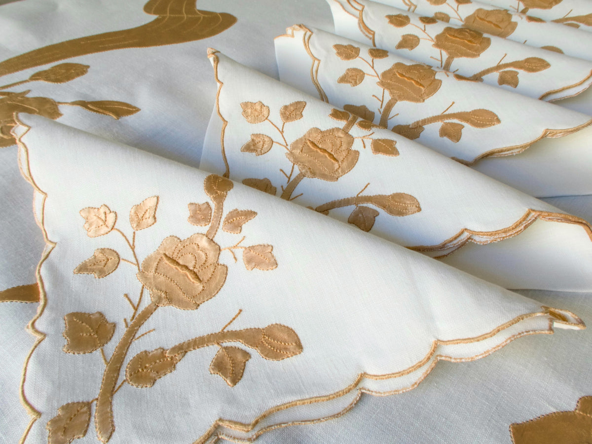 Close-up of satin appliqué rose motif on vintage Madeira linen napkins