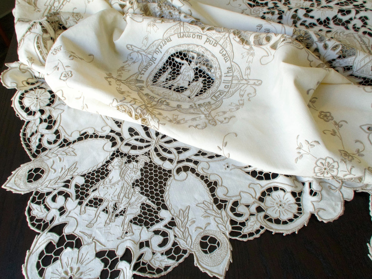 Vintage Madeira tablecloth with hand-embroidered Shakespeare scenes.