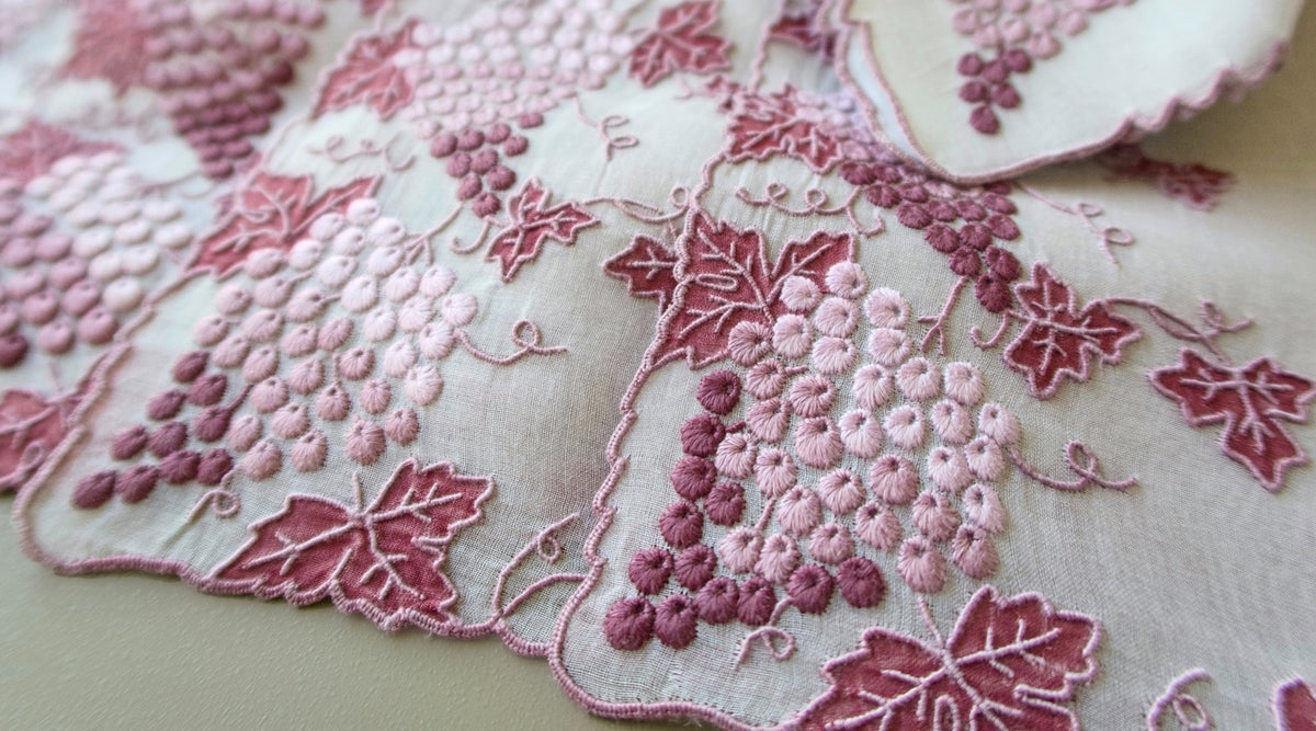 Marghab Vineyard vintage placemats with hand-embroidered grapes on sheer organdy.