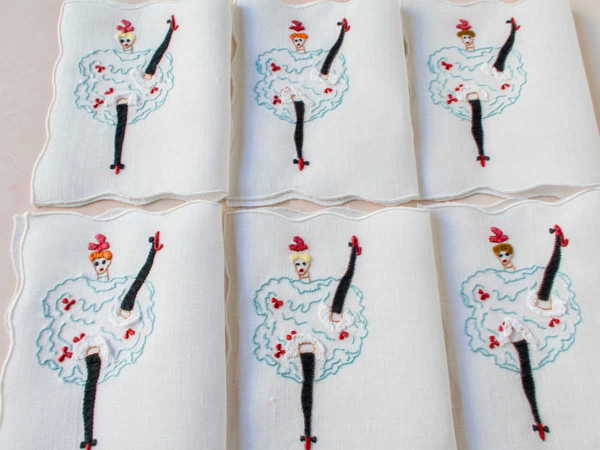 Set of six vintage Madeira cocktail napkins featuring embroidered can-can dancers with applied lace and bright accents.