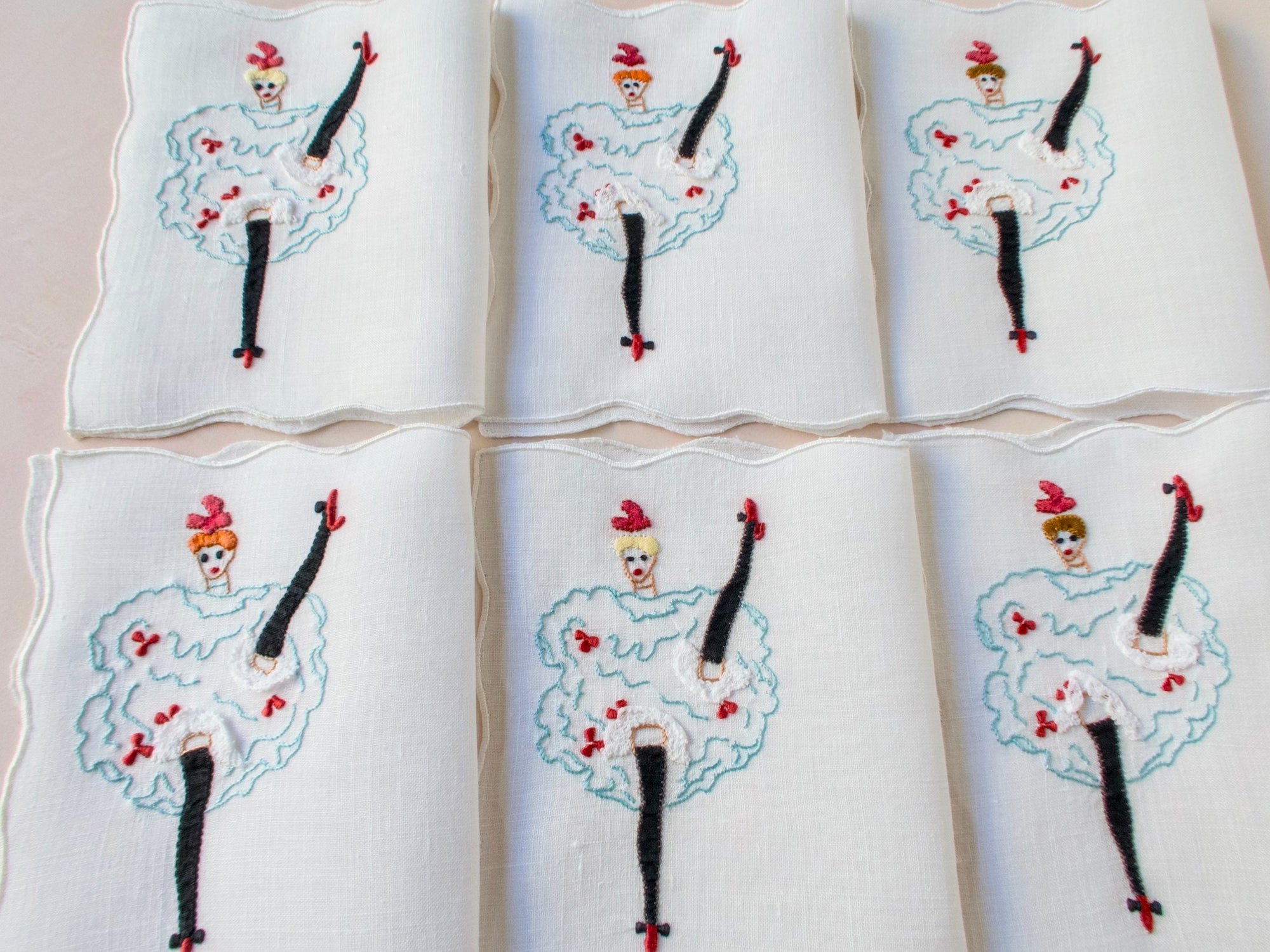Set of six vintage Madeira cocktail napkins featuring embroidered can-can dancers with applied lace and bright accents.